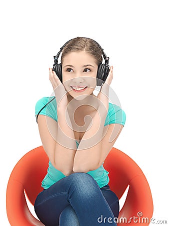 Happy teenage girl in big headphones Stock Photo