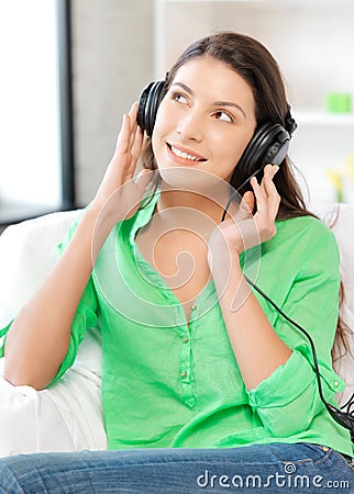 Happy teenage girl in big headphones Stock Photo