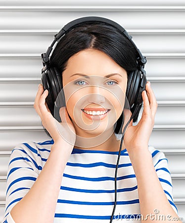 Happy teenage girl in big headphones Stock Photo