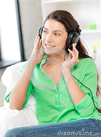 Happy teenage girl in big headphones Stock Photo