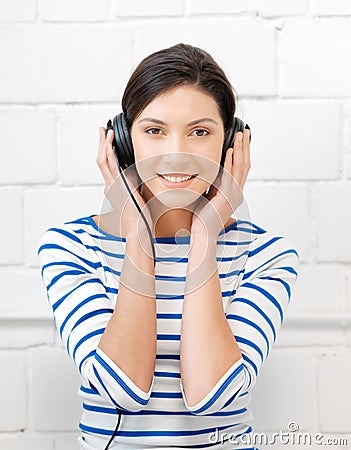 Happy teenage girl in big headphones Stock Photo
