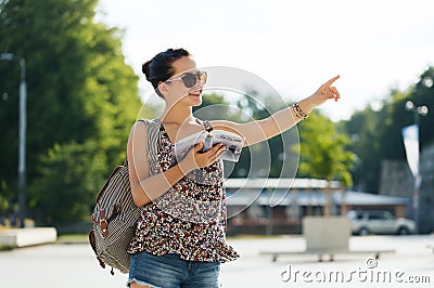 Happy teenage girl with guidebook and backpack Stock Photo