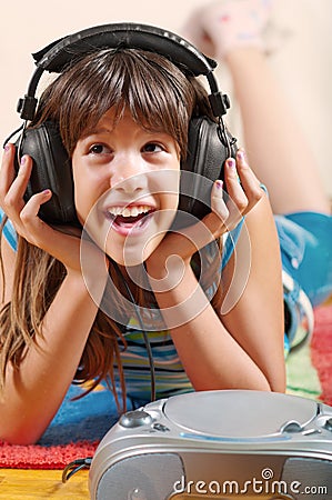 Happy teenage girl listening to music Stock Photo