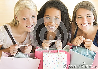 Happy Teenage Girls With Shopping Bags Stock Photo