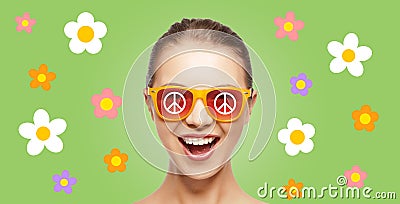 Happy teenage hippy girl in shades with peace sign Stock Photo