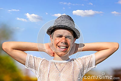 Happy Teenager in a Hat Stock Photo
