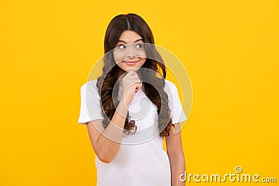 Happy teenager, positive and smiling emotions of teen girl. Smart nerdy school girl touching cheek and thinking against Stock Photo