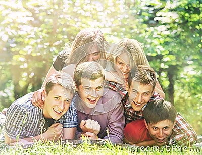 Happy teenagers friends have a fun in the summer park Stock Photo