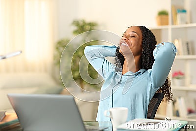 Happy tele worker relaxing breathing at home Stock Photo