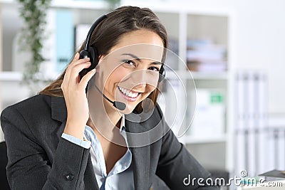 Happy telemarketer posing looking camera at office Stock Photo