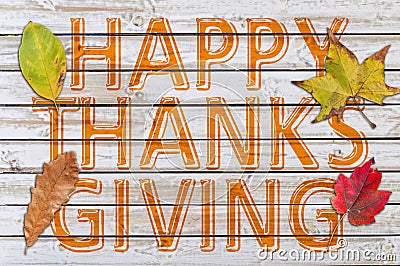 Happy Thanks Giving with four autumn leaf written on white wood Stock Photo