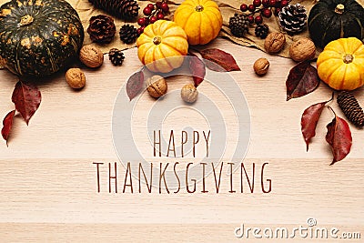 Happy Thanksgiving Day with pumpkin and nut on wooden background Stock Photo