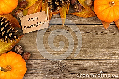 Happy Thanksgiving gift tag with autumn corner border over wood Stock Photo