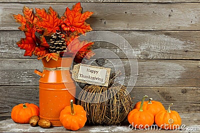 Happy Thanksgiving tag with autumn decor against wood Stock Photo