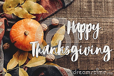 Happy thanksgiving text sign flat lay. pumpkin with leaves and Stock Photo