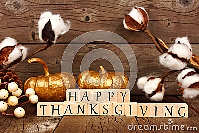 Happy Thanksgiving wooden blocks with gold pumpkins and decor Stock Photo