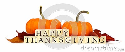 Happy Thanksgiving wooden blocks with autumn decor over white Stock Photo