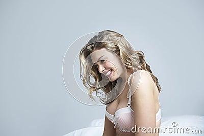 Happy Thoughtful Woman In Bed Stock Photo