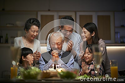 Three generation asian family celebrating grandpa`s birthday at home Stock Photo