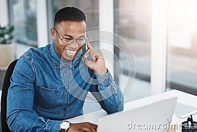 Always happy to assist you with all your queries. a young businessman taking a phone call at his office desk. Stock Photo