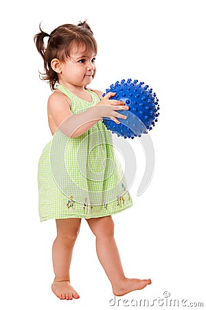 Happy toddler girl with ball Stock Photo