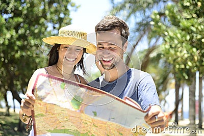 Happy tourist couple with map Stock Photo