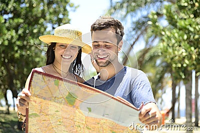 Happy tourist couple with map Stock Photo