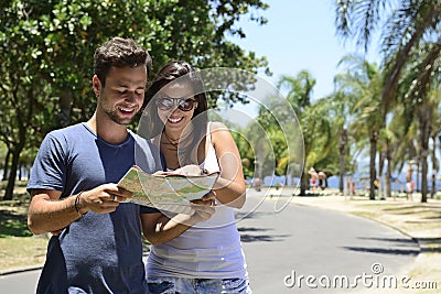 Happy tourist couple with map Stock Photo