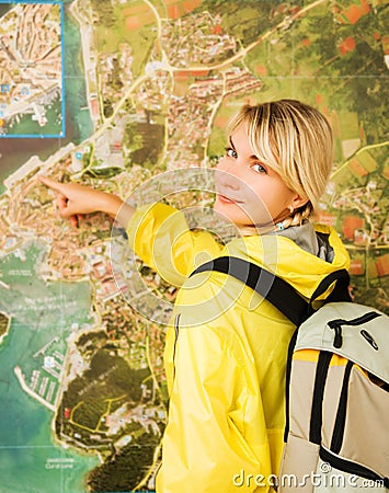 Happy tourist near the map Stock Photo