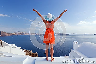 Happy tourist woman on Santorini island, Greece. Travel Stock Photo