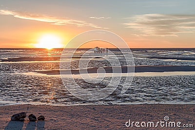 Happy tourists enjoy Sunset during four wheel tour in Salt flat Lake Salar de Uyuni in Bolivia Editorial Stock Photo