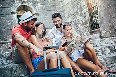 Happy tourists sightseeing in city Stock Photo