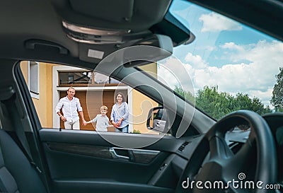 Happy traditional family near their house portrait who bought new car. Inside car view Stock Photo