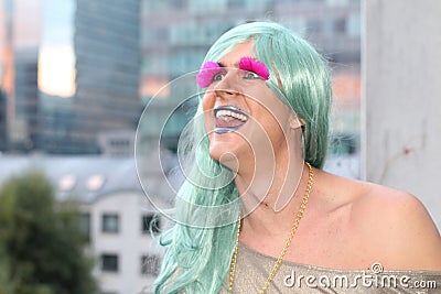 Happy transvestite smiling in the city Stock Photo