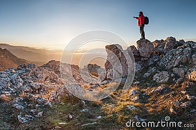 A happy traveler on a mountain top Stock Photo