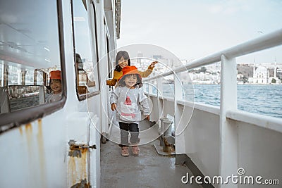 little girl running around the ferryboat Stock Photo