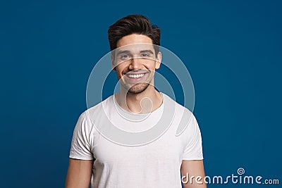 Happy unshaven guy smiling and looking at camera Stock Photo