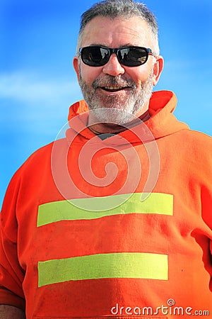 Happy Unshaven Laborer Wearing Sunglasses Stock Photo
