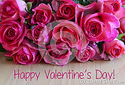 Happy Valentine`s Day.Bouquet of pink roses on wooden background.St Valentine`s Day concept with copy space. Stock Photo