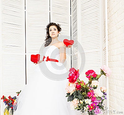 Happy Valentine's Day. Bride with red heart. Wedding and Valentine concept. Stock Photo