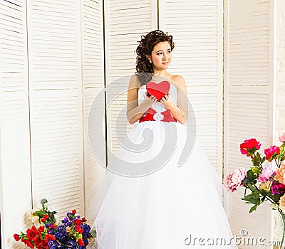 Happy Valentine's Day. Bride with red heart. Wedding and Valentine concept. Stock Photo