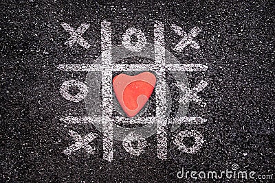 Happy Valentines day card, Tic tac toe game on the ground, xoxo and stone Stock Photo