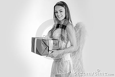 Happy Valentines day - copy space. Angel girl with blonde hair. arrow and wings. Cupid girl aiming at someone with an Stock Photo