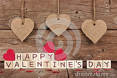 Happy Valentines Day wooden blocks with heart decor on wood Stock Photo