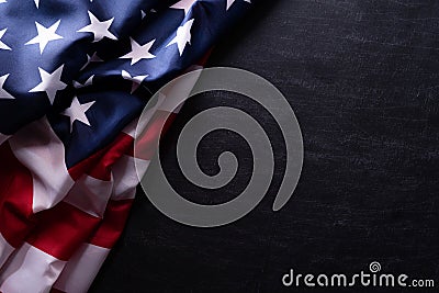 Happy Veterans Day. American flags veterans against a blackboard background Stock Photo