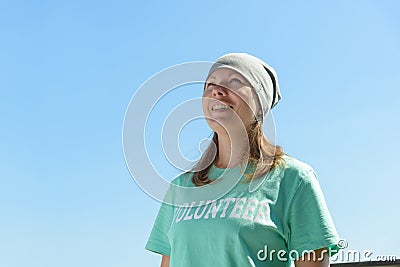 A happy volunteer woman outdoors portrait Stock Photo