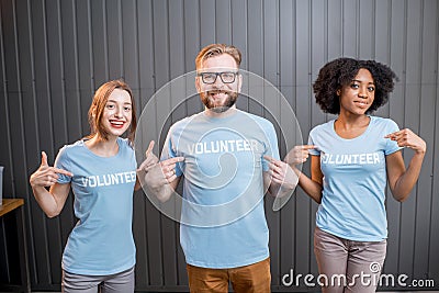 Happy volunteers indoors Stock Photo