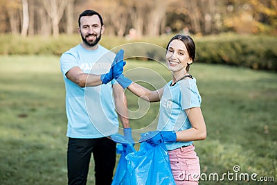 Happy volunteers in the paark Stock Photo