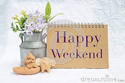 Happy Weekend card with elephants clay sculpture Stock Photo