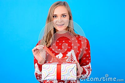 Happy winter holidays! Lovely cute excited girl in red Christmas Stock Photo